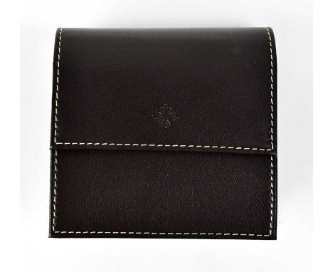 PATEK PHILIPPE; a branded brown leather watch travel case, with stitched edges and inner cushion, 11 x 11 4cm.