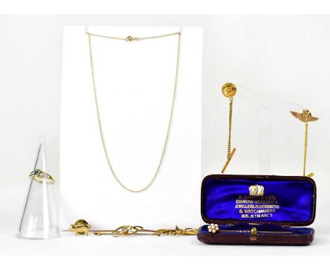 A group of 9ct yellow gold jewellery, comprising a ring set with an oval sapphire, size M, a fine chain, three tie studs, inc