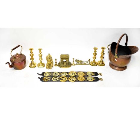 A mixed lot of metalware including a copper coal scuttle, copper and brass kettle with incised decoration, brass candlesticks
