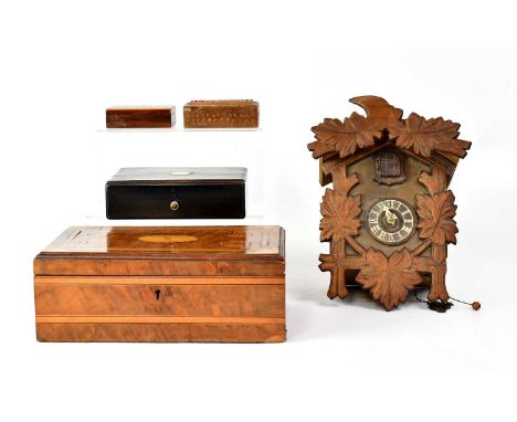 A marquetry inlaid box, 10 x 26.7 x 16cm, an ebonised box set with mother of pearl cartouche to the lid, with satin lining in