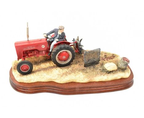 BORDER FINE ARTS; a tractor figure group, 'Lifting the Pinks', model no. B250, a red tractor with plough, on wooden plinth, l
