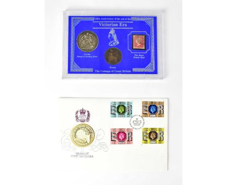 A Victorian 1891 silver crown encapsulated together with an 1899 penny and a Penny Red stamp, and a first day coin cover for 