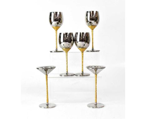 STUART DEVLIN FOR VINERS; a set of four stainless steel c.1970s goblets/chalices with textured gold-coloured stems, height of