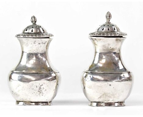 SNOW &amp; ASHWORTH; a pair of Victorian hallmarked silver pepper shakers, baluster form with finial, height 9.5cm, Birmingha