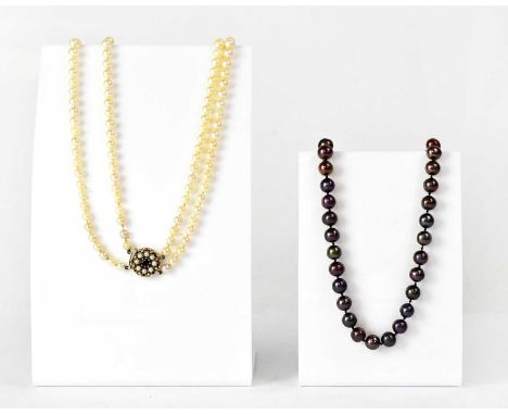 A double-strand pearl necklace with a 9ct yellow gold clasp set with pearls and a red stone, length approx. 51cm, maker's mar