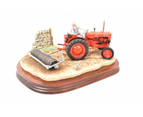 BORDER FINE ARTS; a tractor figure group, 'Turning with Care', model no. B0094, a red tractor reversing, on wooden plinth, le