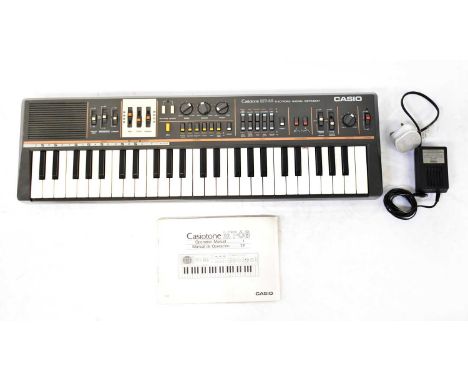 CASIO; a vintage boxed Casiotone MT-68 portable electronic keyboard synthesizer, with instruction manual, complete with power