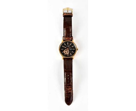 BULOVA; an automatic wristwatch, the black dial set with baton numerals, with window verso displaying the mechanism, dial dia