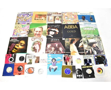 A quantity of vinyl LP records and 45rpm singles to include Blondie, Lionel Richie, 2Pac, ABBA, Status Quo, Michael Jackson, 