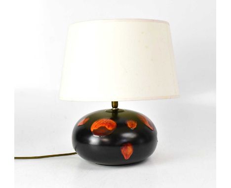 POOLE; a squat 'Galaxy' lamp with black ground and red lava-style glaze decoration, height to top of fitment 23cm, with shade