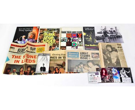 A collection of rock and pop memorabilia, mostly relating to groups from the 1960s, including a reproduction black and white 