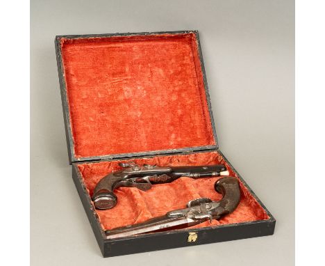 Pair of Duelling Pistols, signed Barbey Paris. Octagonal canted barrell with damascene decoration in wooden shaft. Fluted and