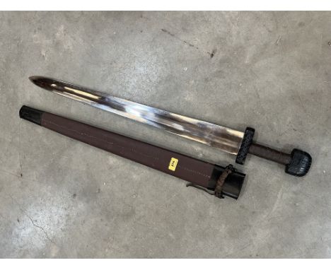 A re-enactment sword with leather scabbard. Length of blade 30'