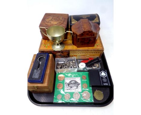 A tray of wooden trinket boxes, coins, watches, plated trophy, key ring, whistle etc 