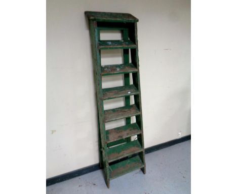 A set of vintage wooden step ladders 