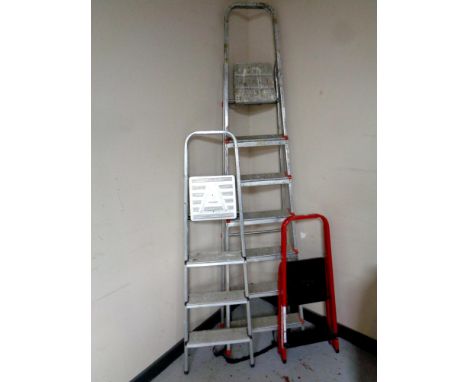 A seven step aluminium folding ladder together with two further pairs of folding steps 