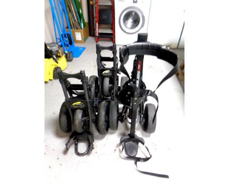 Two power caddy twin line 3 folding golf carts together with a further 5-series golf cart 