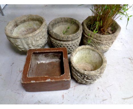Four concrete garden planters together with a further salt glazed trough 