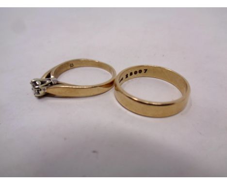 A 9ct gold lady's dress ring together with a 9ct gold wedding band