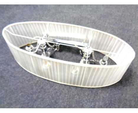 A contemporary twin three branch light fitting with oversized shade  