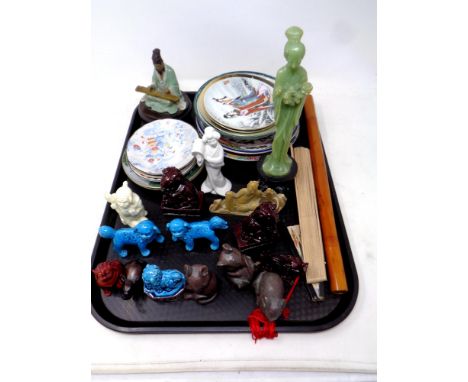 A tray of Oriental resin and ceramic figures, hand fan, flute, plates 