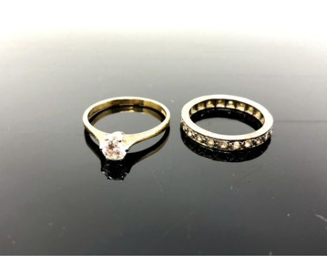 A yellow gold diamond solitaire ring, 1.9g,  together with an unmarked eternity ring. (2) CONDITION REPORT: Diamond diameter 