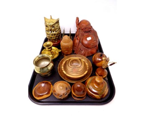 A tray of carved Buddha figure, treen pieces, brass ware, letter rack, candlestick