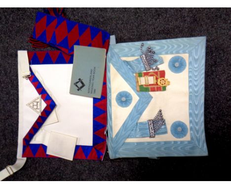 Two Freemasons aprons together with sash, medal and book