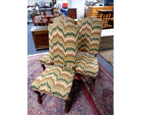 A set of three oak high backed dining chairs upholstered in tapestry fabric 
