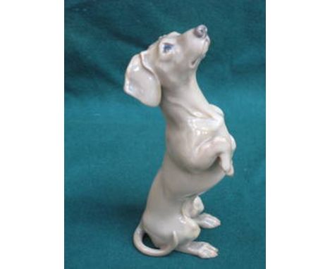 DANISH CERAMIC FIGURE DEPICTING A DOG 