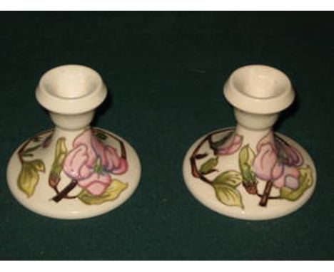 MOORCROFT HANDPAINTED TUBE LINED FLORAL DECORATED GLAZED CERAMIC CANDLE STANDS, APPROXIMATELY 9cm HIGH 