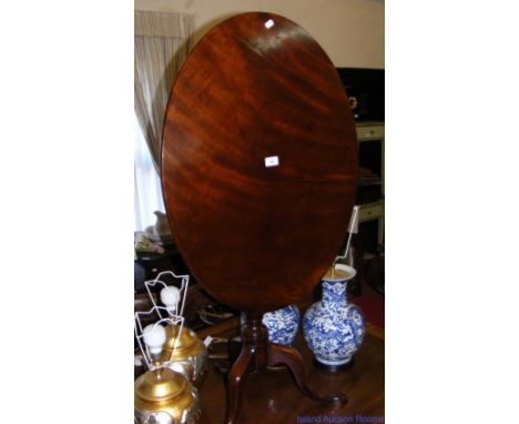 Georgian mahogany oval snap-top occasional table on turned centre column and shaped tripod supports