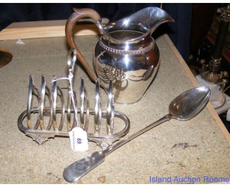 An old Sheffield plated jug, similar toast rack and an early Elkington large basting spoon with crest to the handle