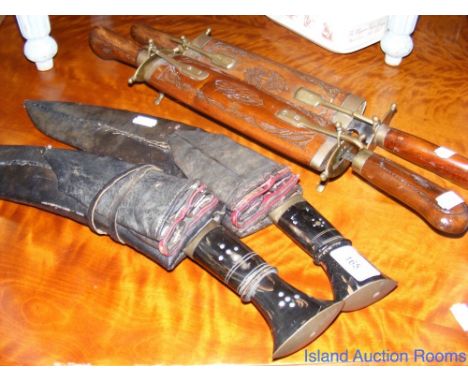 Two Nepalese kukris and two travelling knife and fork sets in carved wood cases