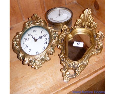 Brass cased aneroid ship's barometer, battery wall clock and small mirror