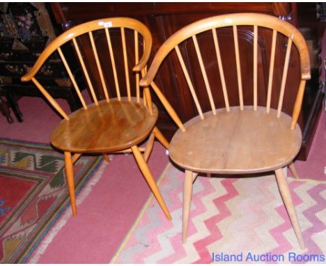 A pair of Retro light Ercol stick back armchairs