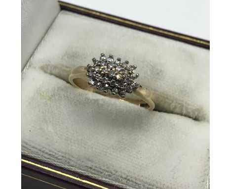 A Ladies 9ct gold ring set with a diamond cluster, Ring size K, Weighs 2.49grams. 