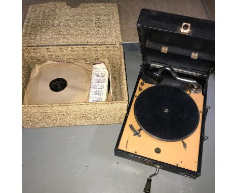 A Vintage Decca 10 portable gramophone with a basket of old records 