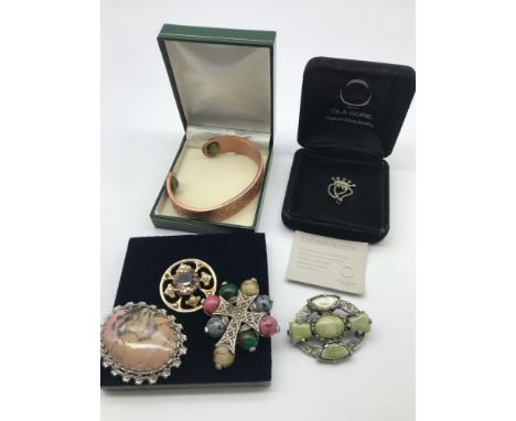 A collection of mixed Scottish and Celtic jewellery which includes Silver Ola Gorie Luckenbooth brooch with box and certifica