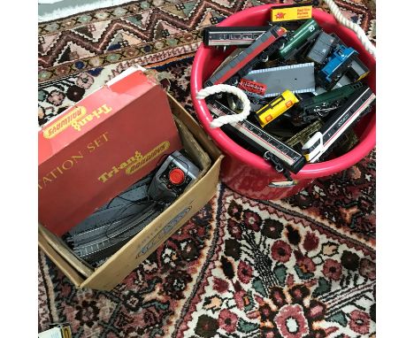A Collection of vintage Tri-ang and Hornby track, buildings, power packs, locomotives and carriages. 