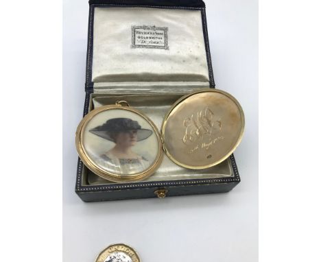 A Beautiful Art Deco 15ct gold and white enamel large locket, engraved E.M.P 9th May 1925. Includes a hand painted portrait o