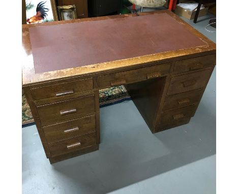 A vintage oak &amp; leather top knee hole desk. 