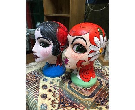 A Lot of two unique hand painted mannequin heads by two different artists. Both dated 2012. 