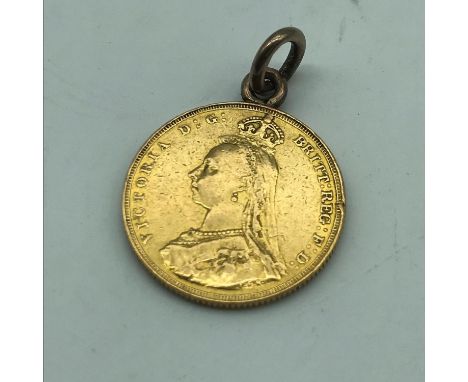 An 1887 Gold full sovereign coin. Has a gold hoop attached to the top. 