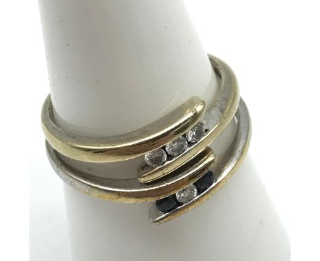 Two 9ct gold ladies eternity rings one is set with 0.10ct diamonds, ring size L &amp; The other is set with two sapphires and