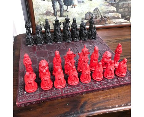 A Vintage oriental chess set, figures are made from plaster/chalk.