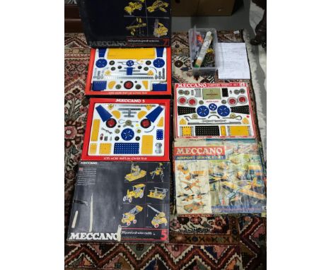A Collection of vintage Meccano sets which includes Airport service set, Two Meccano kits and a box of loose Meccano parts 