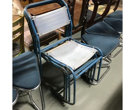 A Lot of four vintage metal stacking chairs. 