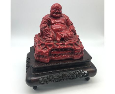 Antique Chinese red Lacquered Hotei Buddha statue on hand carved wooden stand. Measures 22cm in height including stand.