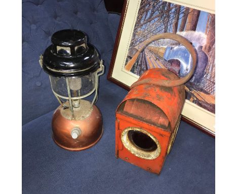 A Vintage Tilley storm lamp together with a railway signal lamp. 